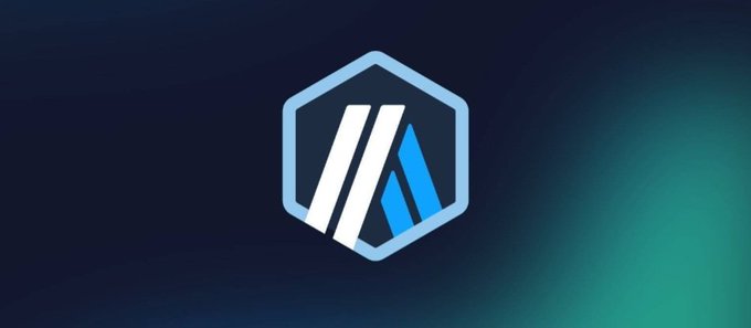 A hexagonal blue and white logo featuring stylized 'M' or 'AA' lettering set against a dark blue and green gradient background.