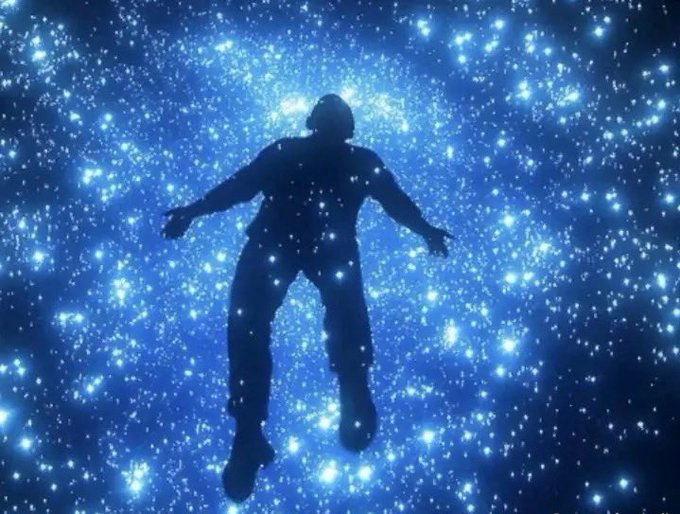 A silhouetted figure floats against a vibrant, starry blue cosmic background, evoking a sense of awe and wonder. The image visually captures the euphoric, transcendent feeling expressed in the post about renewed excitement in crypto, symbolizing optimism amid a hopeful early bull market.