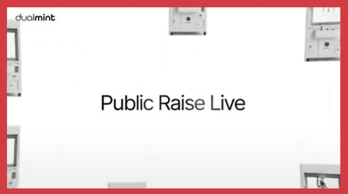 A promotional graphic with a red frame featuring the text "dualnt" logo and "Public Raise Live" centered on a white background with partial machinery visible at the edges.
