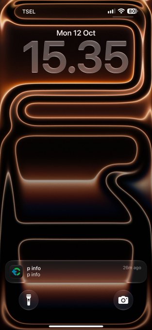 A smartphone lock screen displays the time "15.35" and date "Mon 12 Oct" against a dark, abstract background with glowing orange curved lines. Status bar shows "TSEL" carrier with full signal, Wi-Fi, and 80% battery, while a notification at the bottom reads "p info" from "20m ago."