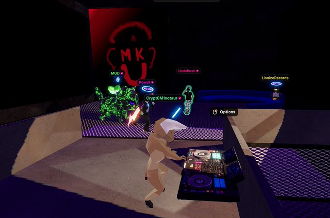 A screenshot from a virtual reality game showing avatars DJing at a club with the 'MKU' logo on the wall and usernames like 'CryptoM1notasur' and 'LionelzeRecords' displayed.