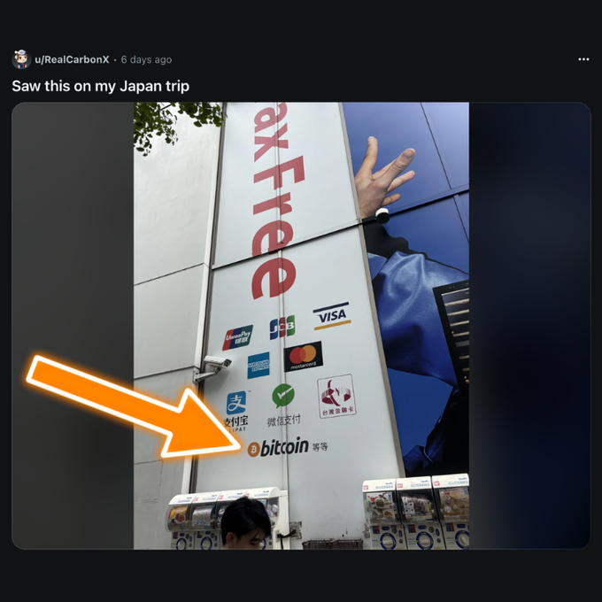 A Reddit post by u/RealCarbonX titled 'Saw this on my Japan trip' shows a building exterior with payment method logos including Visa, Mastercard, UnionPay, Alipay, WeChat Pay, and a highlighted Bitcoin logo.