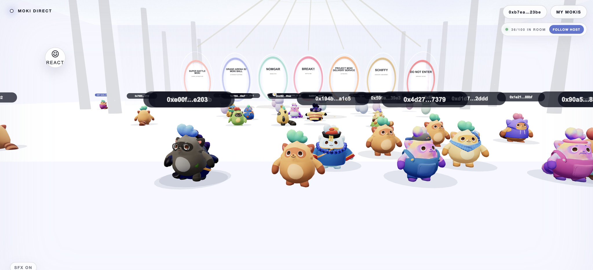 A screenshot from a virtual world shows multiple cartoonish creature avatars in a white room with portal-like arches labeled 'SUPER BATTLE MOKI', 'GRAND ARENA S2 MONI BALL', 'NOMGAR', 'BREAK!!', 'PROJECT MOKI DELIVERY SERVICE', 'SCHIFFY', and 'DO NOT ENTER', along with user IDs and 'MOKI DIRECT' and 'MY MOKIS' buttons.