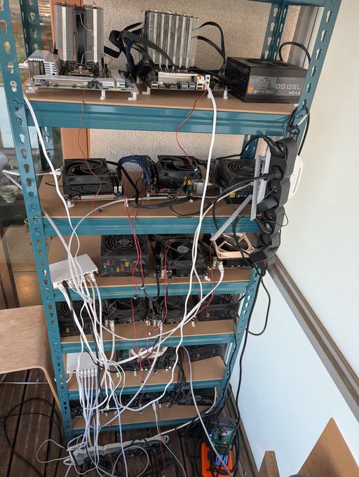 A metal shelving unit holds a cryptocurrency mining rig with multiple GPUs, power supplies, and tangled cables, with a digital display showing 'TECO 50' on the top shelf.