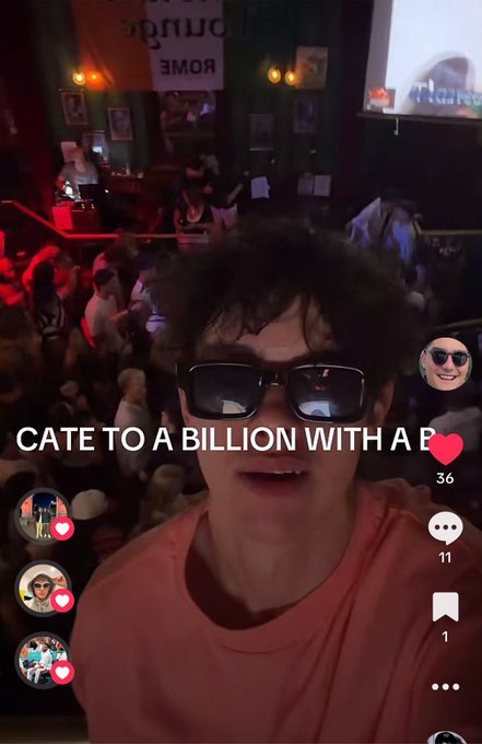 In this TikTok screenshot, a young person wearing sunglasses overlays the text "CATE TO A BILLION WITH A B". The accompanying post mentions "ANOTHER TIKTOK ON $CATE", suggesting the video is related to the stock ticker CATE.