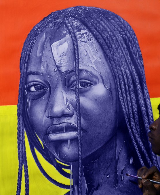 A striking purple-toned portrait painting of a woman with braided hair against a vibrant orange and yellow background, with an artist visible in the bottom right corner working on the piece.