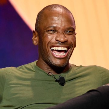 The image features a man wearing a green shirt, sitting down with a smile on his face. The caption reads "Just In: Arthur Hayes dumps his $HYPE and $NEAR position." This suggests that the photo was taken during an event where Arthur Hayes made a statement or shared something humorous about his position in the audience.