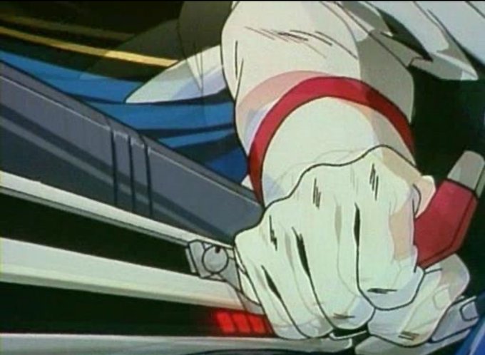 An animated close-up shows a gloved hand gripping a mechanical lever or control device.