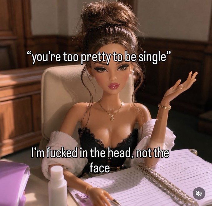 A Barbie-style doll sits at a desk with text reading 'you're too pretty to be single' and 'I'm fucked in the head, not the face'.