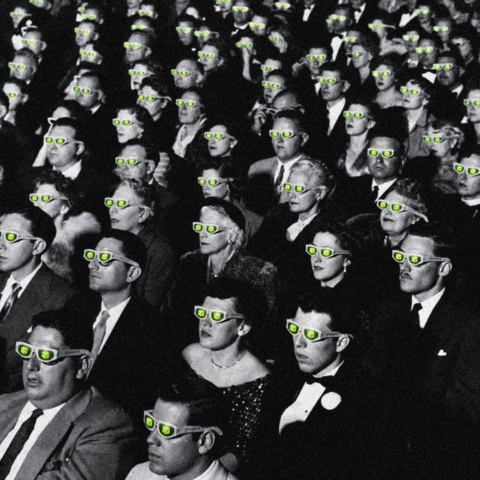 A vintage black-and-white photograph of a movie theater audience, where every face has been edited to wear glowing green sunglasses, evoking a meme-like "degen" or crypto-trader aesthetic. The surreal, uniform glow visually echoes the post's hype about a massive, game-changing feature coming to Robinhood Crypto and its proof-of-liquidity ambitions.