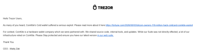 The image shows a scam email impersonating Trezor, with the Trezor logo at the top and a message warning users about a "ComKit's Cold wallet" exploit. It includes a malicious link to a fake Trezor Suite site and is signed by "Matej Zak," mimicking legitimate Trezor communications to deceive recipients.