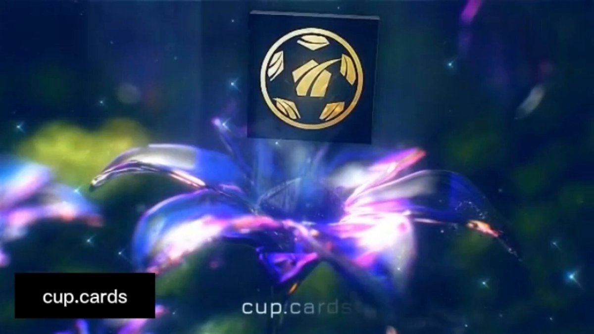 The image features a captivating scene of a purple flower with gold leaves, surrounded by stars against a dark blue background. The flower appears to be floating or hovering above the frame. In the center of this floral spectacle, there's a small square-shaped object that resembles a cupcake. This cupcake is adorned with a gold emblem on top and has a gold border around it. The image also includes text that reads "cup cards" and "GM CT I made a thread and video on CUPcards".