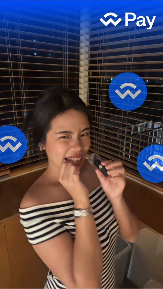 The image features a woman wearing a striped shirt with her hand on her face, possibly posing for a photo or video. The background includes a window with blinds, which adds an interesting element to the scene. The caption of the image reads "part 2 of the @WalletConnect is your money even yours" and it seems to be related to the post about cryptocurrency wallets.
