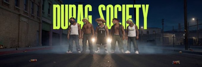 Five men in durags stand confidently on a foggy nighttime street beneath the bold neon green "DURAG SOCIETY" text, with the headlights of a car glowing behind them. The post announces a giveaway for 2 GTD and 10 FCFS whitelist spots for the Durag Society NFT collection, with the image serving as promotional artwork for the project.