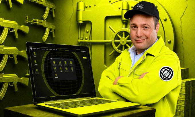 A man in a neon yellow jacket and cap standing with arms crossed next to an open laptop showing a crypto-trading interface, with AK-47 rifles and a vault door in the background.