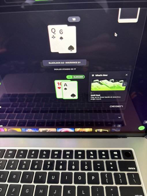 A laptop screen displays an online blackjack game on 'DEGEN' showing a dealer hand of Queen and 6, and a player hand of 10 and Ace, with a 'BLACKJACK 3:2 - INSURANCE 2:1' banner.