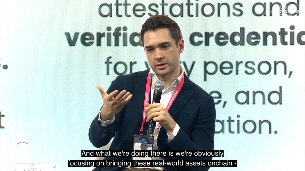 The image shows a man standing up, wearing a suit jacket, giving a speech or presentation with his hands out, possibly as part of a webinar or conference session. The focus of the post seems to be on the man's words and actions, possibly relating them to the software development process or cross-border trade.