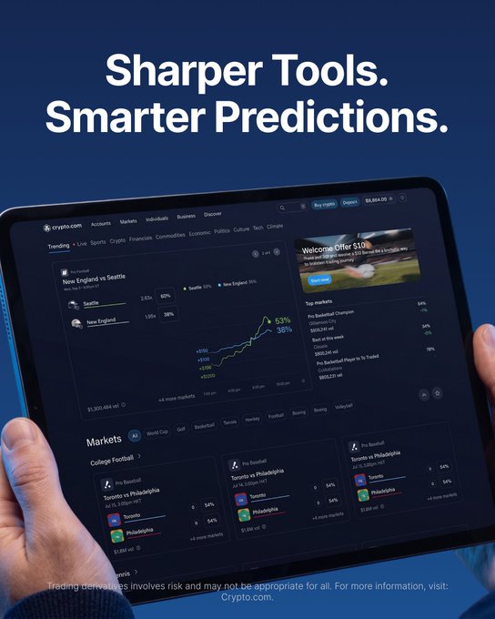 The promotional image showcases a tablet displaying the Crypto.com app with the headline "Sharper Tools. Smarter Predictions," featuring a live prediction market for an NFL matchup between Seattle (63%) and New England (38%), along with College Football markets including Toronto vs Philadelphia matchups with $1,900 vol and 54% odds. The visuals support the post's message about backing favorite players and predicting upcoming matches through Crypto.com's Prediction Trading platform, highlighting features like team formations, player stats, and CFTC-regulated trading capabilities.