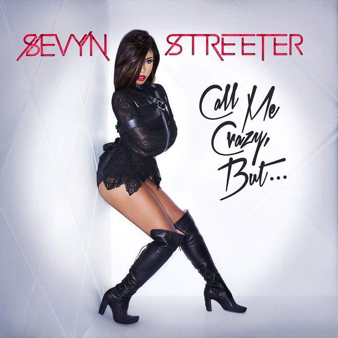 An album cover for 'SEVYN STREETER - Call Me Crazy, But...' shows the artist posing in a black lace bodysuit and thigh-high black boots against a soft gray background.