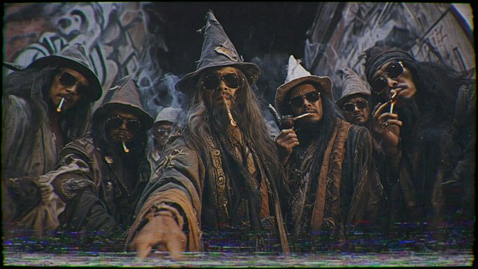 A stylized, grungy image featuring a group of figures dressed as wizards or sorcerers wearing pointed hats and sunglasses, smoking cigarettes.