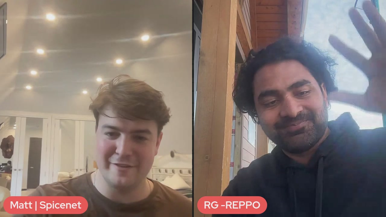 The image shows two men with short hair, both smiling at the camera while taking a selfie together. They are standing next to each other, with one man slightly ahead of the other. The background features a wooden wall that adds an interesting visual element to the scene. The caption "Spicenet x Reppo Private Beta Mainnet" is present in the image, which might be related to the photo or the post itself.