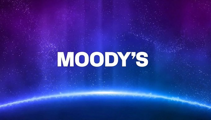 The image features a large, colorful planet with blue and purple hues against a dark background. The text "Moody's" is written in white letters above the planet, indicating that the company has recently moved its credit ratings onto Solana blockchain technology. This move by Moody's is considered quite unusual and noteworthy due to the financial institution's reputation for being conservative and risk-averse. The post also mentions a few other interesting facts about the cryptocurrency market and how it is evolving rapidly.