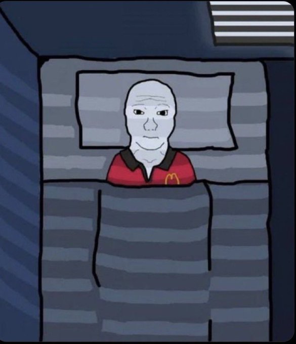 A cartoon illustration depicts a bald, expressionless Wojak character wearing a red McDonald's uniform lying in bed under a striped blanket in a dark room.