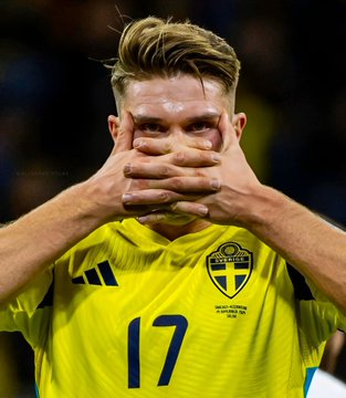 A Swedish football player wearing a yellow #17 jersey with the Swedish Football Association crest covers his face with his hands, symbolizing the sting of betting against Sweden's World Cup hopes. The image likely shows a recent Sweden player, tying into the post about a $693,960.96 payout on Polymarket for Sweden NOT to win the World Cup.
