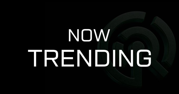 A black screen with white text reading 'NOW TRENDING' alongside a 3D circular logo.