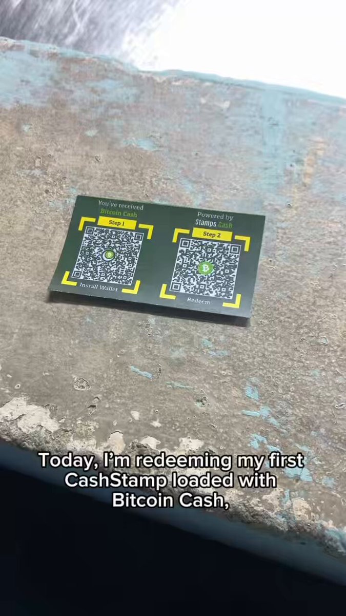 The image shows a green card reader with two QR codes placed on top of a concrete surface, one being a Cash Starprint loaded with Bitcoin Cash. The text "Today I'm redeeming my first CashStarprinted with Bitcoin Cash!" is written below the QR codes.