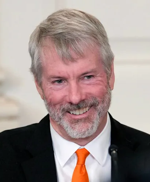 A smiling, bearded man with gray hair in a suit and orange tie is shown, likely a financial commentator or analyst reacting to news that Jane Street has accumulated $225M worth of $MSTR (MicroStrategy/Strategy) shares, valued at $250M.