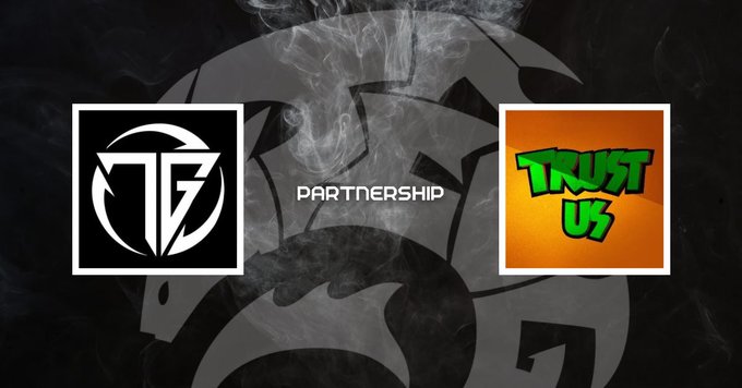 A promotional graphic announcing a partnership, featuring a black and white circular "TG" logo on the left and an orange "TRUST US" NFT logo on the right, with the word "PARTNERSHIP" displayed between them against a smoky dark background—visually representing the new collaboration with TrustUsNFT for their upcoming mint.
