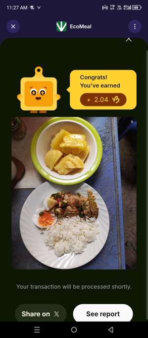 EcoMeal app screenshot showing a confirmation message with a robot mascot stating 'Congrats! You've earned + 2.04' above a photo of a meal with rice and a bowl of yellow soup.