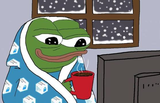 A cozy cartoon Pepe the Frog wrapped in a Link Frog (Chainlink-themed) blanket sips hot cocoa while watching TV as snow falls outside the window.
