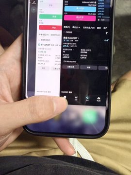 A hand holds a smartphone displaying a stock trading app showing BTC/USDT at 100,776.83 and ETH/USDT, with the screen reflecting the poster's observation of Bitcoin and other assets surging to new heights as "big cakes" (likely BTC) climb past the $100K mark.