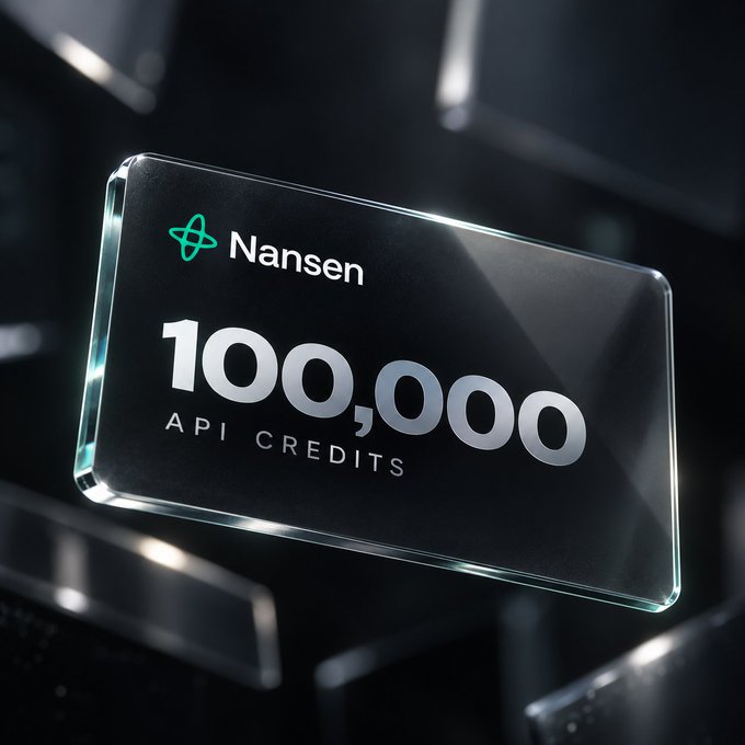 A sleek, dark promotional graphic displays a glass-like card featuring the Nansen logo alongside "100,000 API CREDITS," reinforcing the post's message of rewarding builders with a substantial prize. The polished, tech-forward design emphasizes the value of the giveaway for those already developing in the crypto/blockchain space.