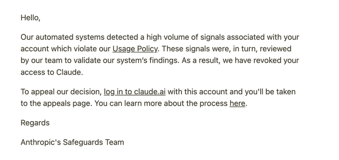 An email notification from Anthropic's Safeguards Team stating that access to Claude has been revoked due to automated systems detecting signals that violate the Usage Policy.