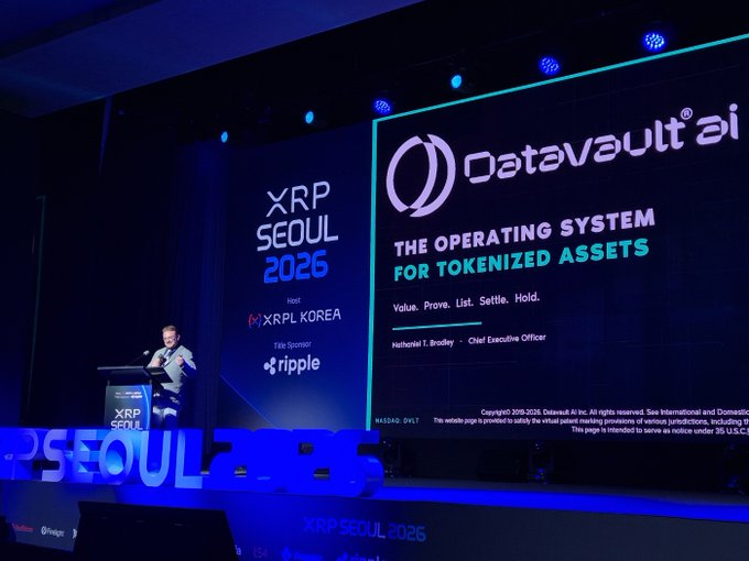 Nathaniel T. Bradley, CEO of Datavault AI, presents "The Operating System for Tokenized Assets" at the XRP Seoul 2026 conference hosted by XRPL Korea and sponsored by Ripple. The stage backdrop highlights Datavault AI's value proposition of "Value. Prove. List. Settle. Hold."