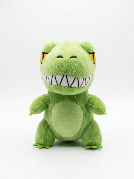 A green plush dinosaur toy with sharp teeth and yellow eyes is shown, which appears to be one of the "Chomperz" plushies mentioned in the post that will be shipped to lucky minters and holders after the upcoming mint.