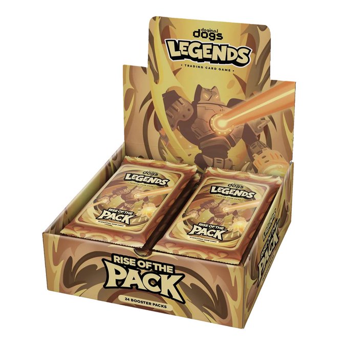 A retail display box for the "Doginal Dogs Legends Trading Card Game – Rise of the Pack" set, containing 24 booster packs with gold and fire-themed artwork of a robotic dog shooting lasers, ties directly to the post announcing that DDLTCG is live and available for purchase at shop.doginaldogs.com.