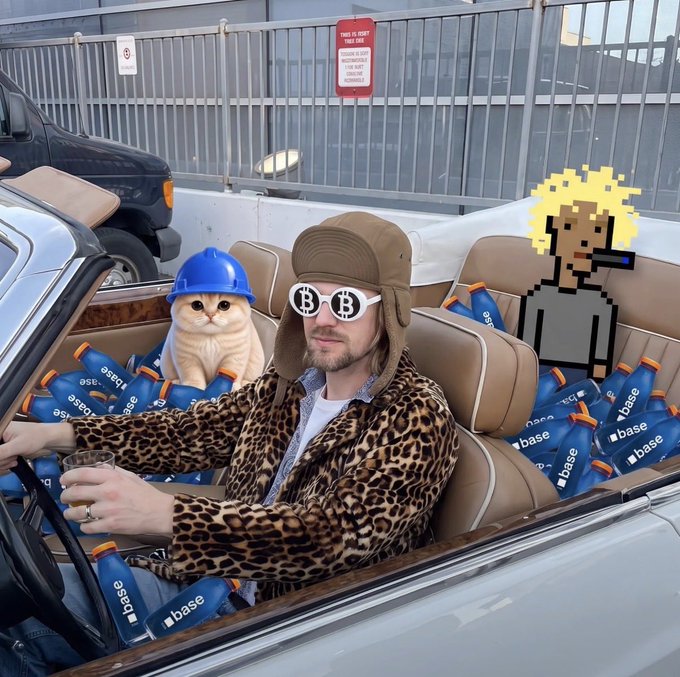A man wearing a trapper hat and Bitcoin-themed sunglasses sits in a convertible surrounded by blue Coinbase-branded bottles and a cat wearing a blue hard hat.