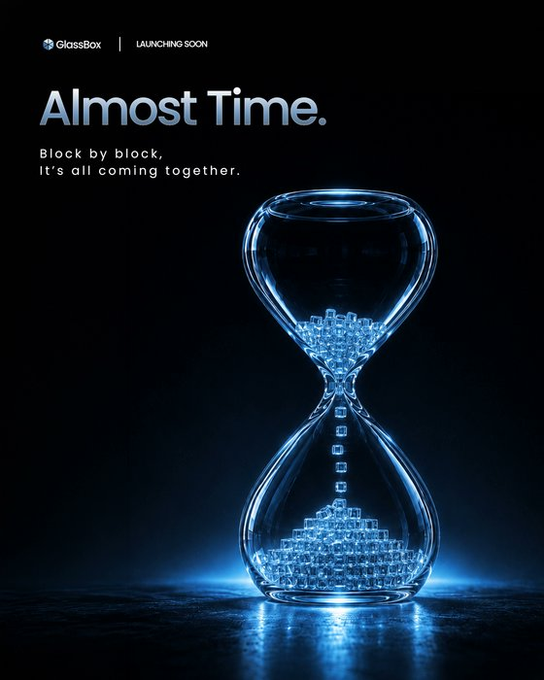 GlassBox promotional graphic featuring a glowing blue hourglass with digital blocks falling through it, with text 'Almost Time. Block by block, it's all coming together.'