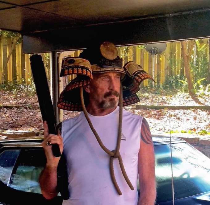 A man wearing an ornate samurai helmet and Adidas tank top holds a shotgun, pairing his battle-ready armor with "it's time for a bullrun" — a fitting visual of gearing up to charge into a bullish market rally.