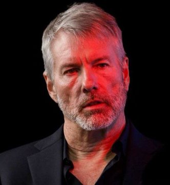 A man with gray hair and a beard, illuminated by dramatic red lighting, gazes thoughtfully at the camera. The image pairs with a quote from Michael Saylor clarifying the distinction between his personal Bitcoin holdings and those of his publicly traded company, Strategy.