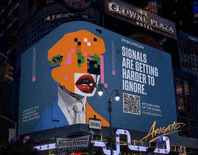 A large billboard advertisement in a city at night displays a stylized orange face with red lips and the text 'SIGNALS ARE GETTING HARDER TO IGNORE' alongside 'R3ORDR' and 'ARIGATO,' with 'CROWNE PLAZA HOTEL' visible above.