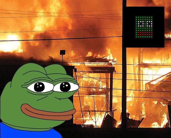A Pepe the Frog meme is overlaid on a background image of a large fire or explosion, with a pixelated LED display in the upper right.