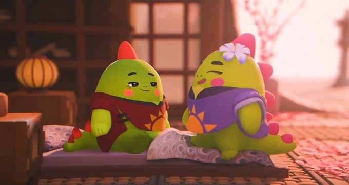 A 3D render of two cute green dinosaurs wearing traditional-style clothing, one holding a brush, sitting on a mat with a paper scroll in a warmly lit room.