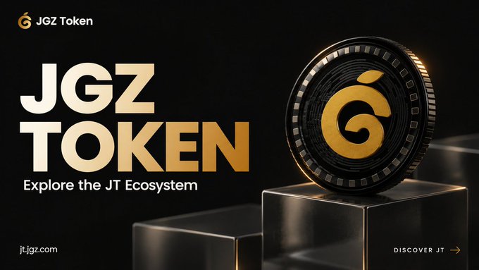 A promotional banner for "JGZ Token" featuring a large gold coin with the "G" logo on a pedestal, with text reading "Explore the JT Ecosystem", "DISCOVER JT", and the website "jt.jgz.com".