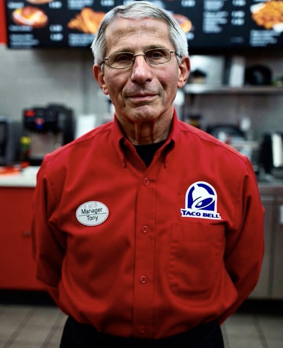 Portrait of an older man wearing a Taco Bell uniform with a 'Manager Tony' name tag inside a restaurant.