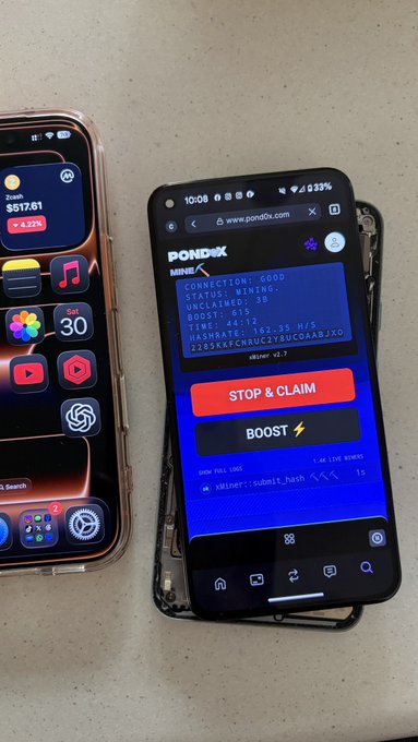 The image shows two cell phones, one with a cracked screen and another displaying a website that says "Stop & Claim" on its screen. The phone with the cracked screen has a black case, while the other phone has a pink case. The background of the image is white, which makes it easier to see the details of the broken phone's screen compared to the other phone.